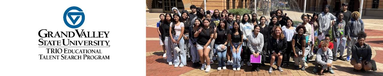 Students pose in front of a fountain